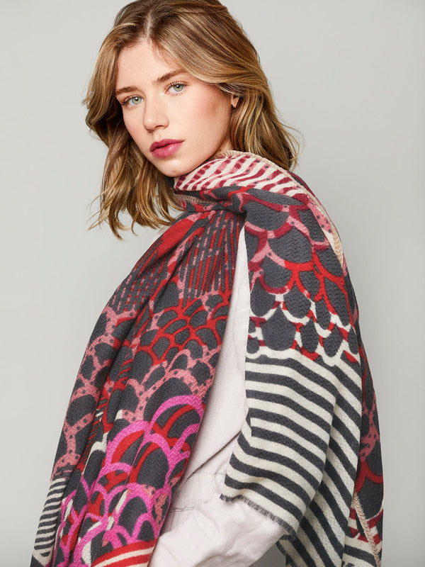 Handcrafted-scarf-red-purple-merino-wool-subtle-chevron-weave-worn-with-style