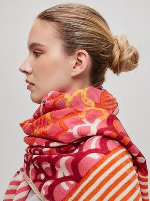 scarf-oange-pink-merino-wool-handcrafted-subtle-relief-chevron-pattern-worn-with-style