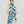 Foulard graphique bleu turquoise en lin et coton porté autour du cou, Princesse & Dragon Montréa