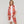 Foulard graphique rouge et orange en lin et coton porté autour du cou, Princesse & Dragon Montréal