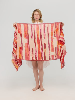 Red orange graphic scarf shown unfolded, Princesse & Dragon Montréal