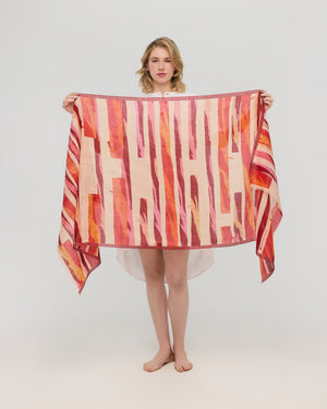 Red orange graphic scarf shown unfolded, Princesse & Dragon Montréal