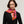 Fuchsia pink silk and cotton square scarf with yellow line-drawn floral print and orange border, loosely knotted at the neck, Princesse & Dragon