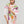 Foulard floral en coton et soie à fleurs orange porté autour du cou, Princesse & Dragon Montréal