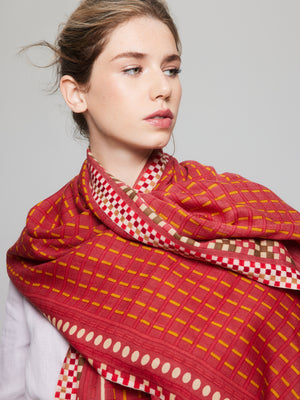 Merino wool scarf in red and yellow, accented with pink for a modern touch. Handcrafted, lightweight, perfect for cool and cold seasons.