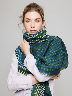 Merino wool scarf with plaid pattern, in forest green, blue, and sky blue tones, hand-printed for a chic and sophisticated look. Versatile accessory for women and men, made by Princesse & Dragon.